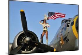 1940's Style Majorette Pin-Up Girl on a B-17 Bomber with an American Flag-null-Mounted Photographic Print