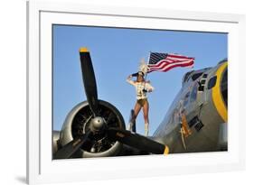 1940's Style Majorette Pin-Up Girl on a B-17 Bomber with an American Flag-null-Framed Photographic Print