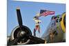 1940's Style Majorette Pin-Up Girl on a B-17 Bomber with an American Flag-null-Mounted Photographic Print