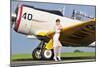 1940's Style Navy Pin-Up Girl Leaning on the Wing of a T-6 Texan-null-Mounted Photographic Print