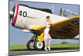 1940's Style Navy Pin-Up Girl Leaning on the Wing of a T-6 Texan-null-Mounted Photographic Print
