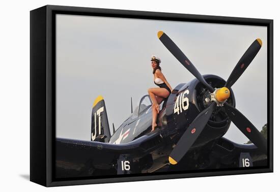 1940's Style Navy Pin-Up Girl Sitting on a Vintage Corsair Fighter Plane-null-Framed Stretched Canvas