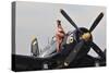 1940's Style Navy Pin-Up Girl Sitting on a Vintage Corsair Fighter Plane-null-Stretched Canvas
