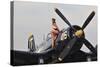 1940's Style Navy Pin-Up Girl Sitting on a Vintage Corsair Fighter Plane-null-Stretched Canvas