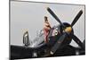 1940's Style Navy Pin-Up Girl Sitting on a Vintage Corsair Fighter Plane-null-Mounted Premium Photographic Print