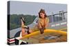 1940's Style Pin-Up Girl Lying on a T-6 Texan Training Aircraft-null-Stretched Canvas