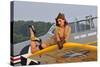1940's Style Pin-Up Girl Lying on a T-6 Texan Training Aircraft-null-Stretched Canvas