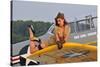 1940's Style Pin-Up Girl Lying on a T-6 Texan Training Aircraft-null-Stretched Canvas