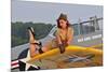 1940's Style Pin-Up Girl Lying on a T-6 Texan Training Aircraft-null-Mounted Photographic Print
