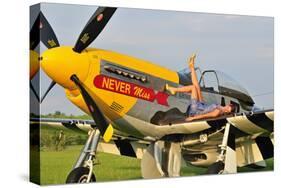 1940's Style Pin-Up Girl Lying on the Wing of a P-51 Mustang-null-Stretched Canvas