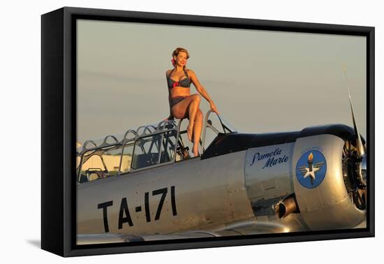 1940's Style Pin-Up Girl Sitting on the Cockpit of a World War II T-6 Texan-null-Framed Stretched Canvas