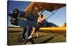 1940's Style Pin-Up Girl Sitting on the Wing of a Stearman Biplane-null-Stretched Canvas