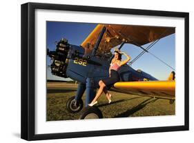 1940's Style Pin-Up Girl Sitting on the Wing of a Stearman Biplane-null-Framed Premium Photographic Print