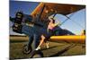 1940's Style Pin-Up Girl Sitting on the Wing of a Stearman Biplane-null-Mounted Photographic Print