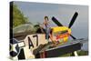1940's Style Pin-Up Girl Standing Barefoot on the Wing of a P-51 Mustang-null-Stretched Canvas