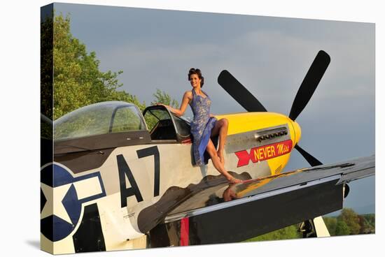 1940's Style Pin-Up Girl Standing Barefoot on the Wing of a P-51 Mustang-null-Stretched Canvas