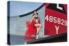 1940's Style Pin-Up Girl Standing on the Tail of a B-17 Bomber-null-Stretched Canvas