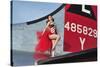 1940's Style Pin-Up Girl Standing on the Tail of a B-17 Bomber-null-Stretched Canvas