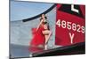 1940's Style Pin-Up Girl Standing on the Tail of a B-17 Bomber-null-Mounted Premium Photographic Print