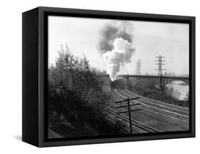 1940s Aerial of Train Traveling Along River under Bridge Billowing Smoke Near Columbus, Ohio-null-Framed Stretched Canvas