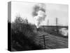 1940s Aerial of Train Traveling Along River under Bridge Billowing Smoke Near Columbus, Ohio-null-Stretched Canvas