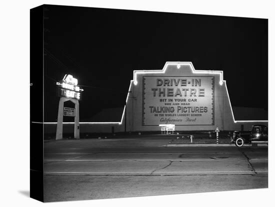 1940s MARQUEE SIGN FOR DRIVE-IN MOVIE THEATER LIT UP AT NIGHT-Panoramic Images-Stretched Canvas