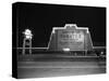 1940s MARQUEE SIGN FOR DRIVE-IN MOVIE THEATER LIT UP AT NIGHT-Panoramic Images-Stretched Canvas