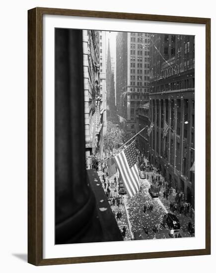 1945 Aerial View of VE Day Celebration on Wall Street NYC with Flags and Confetti Flying-null-Framed Premium Photographic Print