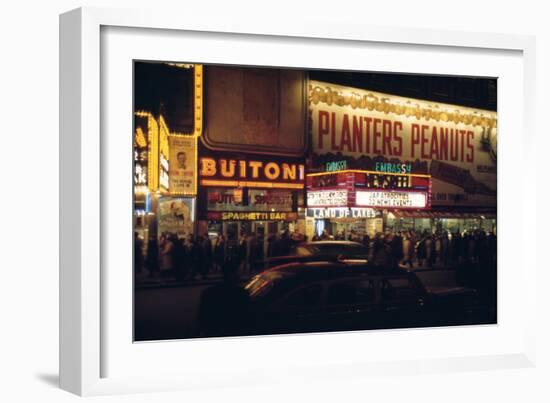 1945: Embassy Theater Showing Newsreel Format Films at Night, Times Square, New York, NY-Andreas Feininger-Framed Photographic Print