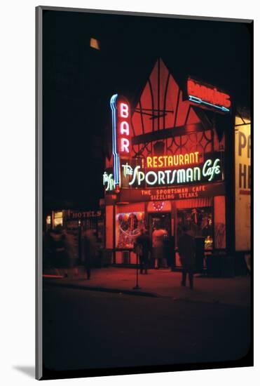 1945: Neon Lights Outside the Sportsman Cafe on 236 West 50th Street at Night, New York, NY-Andreas Feininger-Mounted Photographic Print