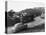 1950s AUSTIN CAR DRIVING UP THE HOLLYWOOD HILLS WITH HOLLYWOOD SIGN IN DISTANCE LOS ANGELES CA USA-Panoramic Images-Stretched Canvas