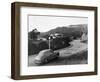 1950s AUSTIN CAR DRIVING UP THE HOLLYWOOD HILLS WITH HOLLYWOOD SIGN IN DISTANCE LOS ANGELES CA USA-Panoramic Images-Framed Photographic Print