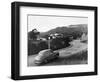 1950s AUSTIN CAR DRIVING UP THE HOLLYWOOD HILLS WITH HOLLYWOOD SIGN IN DISTANCE LOS ANGELES CA USA-Panoramic Images-Framed Photographic Print