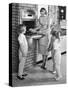 1950s MOTHER AND THREE DAUGHTERS STANDING AROUND OVEN IN KITCHEN BAKING PIE-Panoramic Images-Stretched Canvas