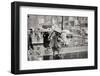 1950s PEDESTRIANS WOMAN HOLDING BOX OVER HEAD CAUGHT IN SUDDEN RAIN STORM 12TH & MARKET STREETS...-H. Armstrong Roberts-Framed Photographic Print