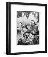 1950s SMILING WOMAN LOOKING AT CAMERA RIDING IN SLEIGH WEARING LEOPARD SKIN FUR COAT AT MAILBOX...-Panoramic Images-Framed Photographic Print