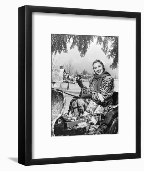 1950s SMILING WOMAN LOOKING AT CAMERA RIDING IN SLEIGH WEARING LEOPARD SKIN FUR COAT AT MAILBOX...-Panoramic Images-Framed Photographic Print