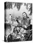 1950s SMILING WOMAN LOOKING AT CAMERA RIDING IN SLEIGH WEARING LEOPARD SKIN FUR COAT AT MAILBOX...-Panoramic Images-Stretched Canvas