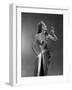 1950s WOMAN WEARING METALLIC EVENING GOWN HOLDING UP WINE GLASS PROFILE-Panoramic Images-Framed Photographic Print