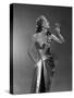 1950s WOMAN WEARING METALLIC EVENING GOWN HOLDING UP WINE GLASS PROFILE-Panoramic Images-Stretched Canvas