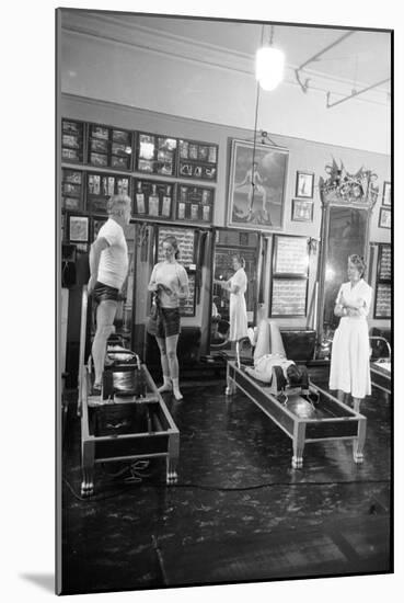 1951: Roberta Peters Working Out with Joseph Pilates and Others in a Studio, New York, NY-Michael Rougier-Mounted Photographic Print