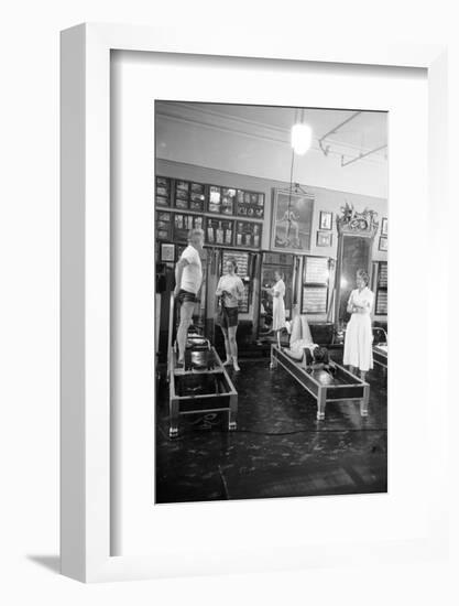 1951: Roberta Peters Working Out with Joseph Pilates and Others in a Studio, New York, NY-Michael Rougier-Framed Premium Photographic Print