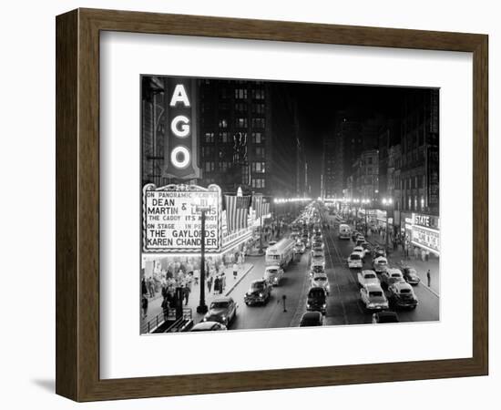 1953 Night Scene of Chicago, State Street with Traffic and Movie Marquee with Pedestrians-null-Framed Photographic Print