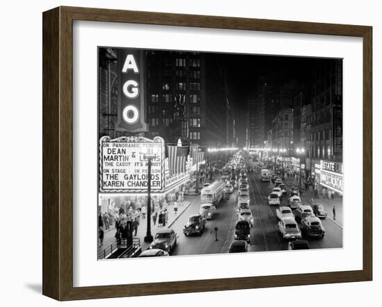 1953 Night Scene of Chicago, State Street with Traffic and Movie Marquee with Pedestrians-null-Framed Premium Photographic Print
