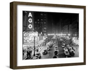 1953 Night Scene of Chicago, State Street with Traffic and Movie Marquee with Pedestrians-null-Framed Premium Photographic Print