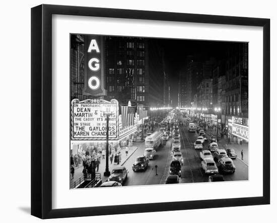 1953 Night Scene of Chicago, State Street with Traffic and Movie Marquee with Pedestrians-null-Framed Premium Photographic Print