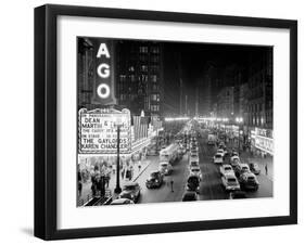 1953 Night Scene of Chicago, State Street with Traffic and Movie Marquee with Pedestrians-null-Framed Premium Photographic Print