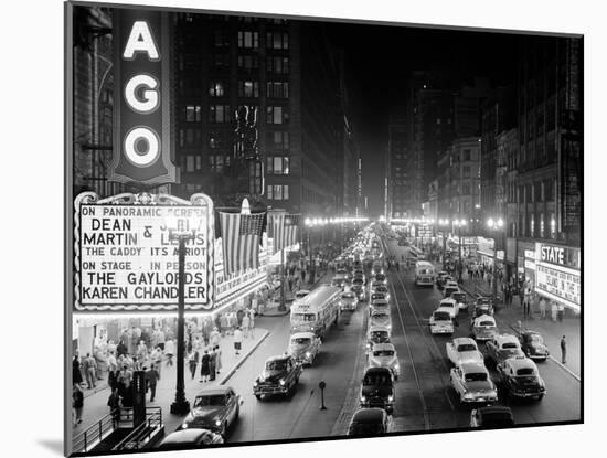 1953 Night Scene of Chicago, State Street with Traffic and Movie Marquee with Pedestrians-null-Mounted Premium Photographic Print