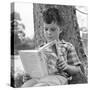 1960s 1970s BOY LEANING AGAINST TREE READING BOOK-Panoramic Images-Stretched Canvas