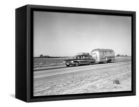 1960s-1970s Family Station Wagon and Camping Trailer Driving on Country Highway on Vacation-null-Framed Stretched Canvas